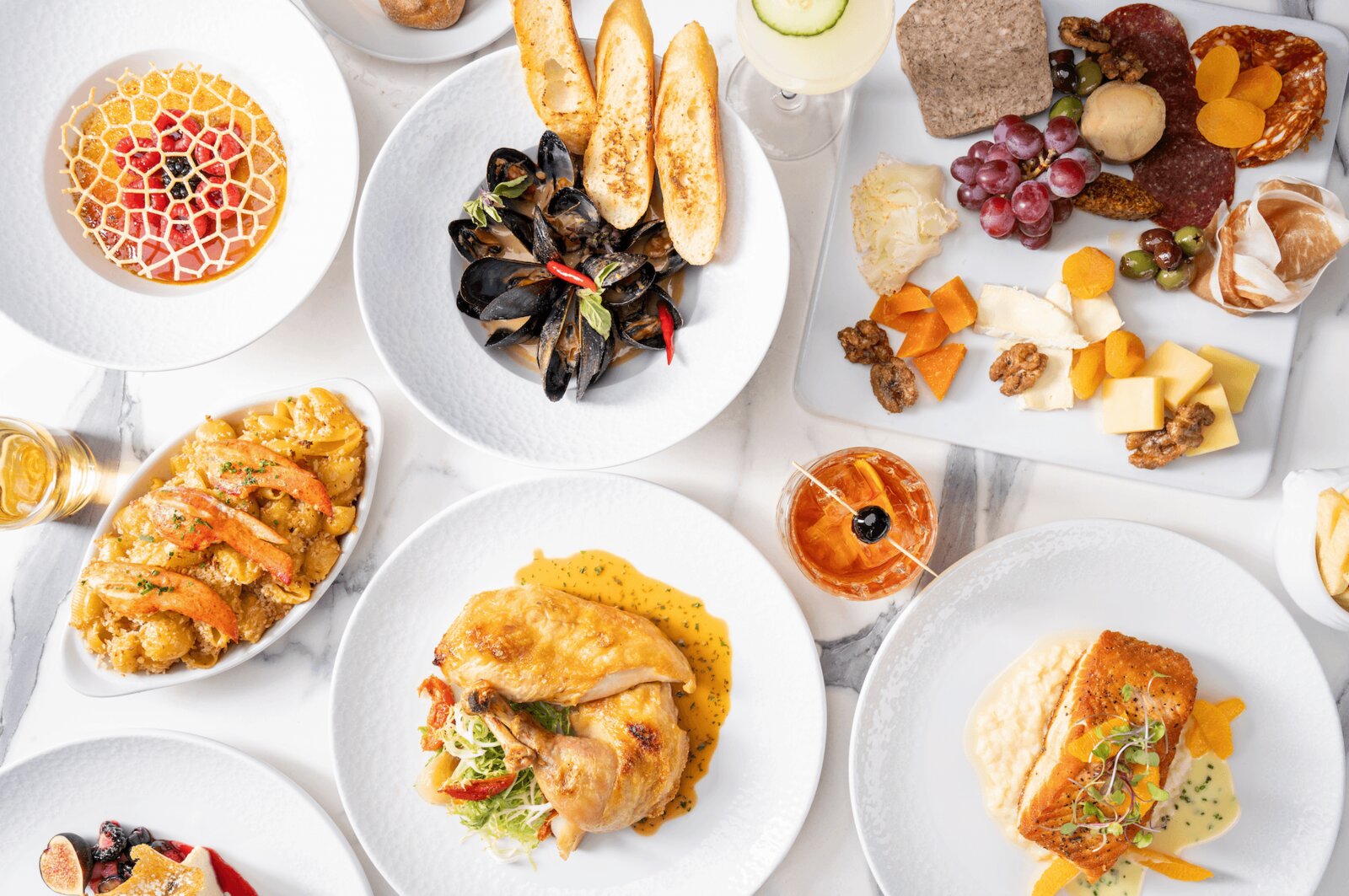 Tasting spread of French dishes, mussels, and charcuterie at Marché Bacchus